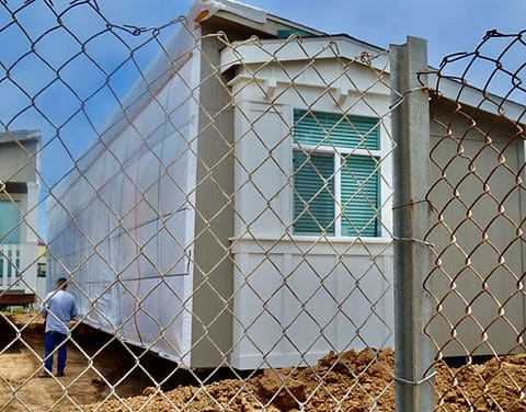 Manufactured home exterior with window detail during installation