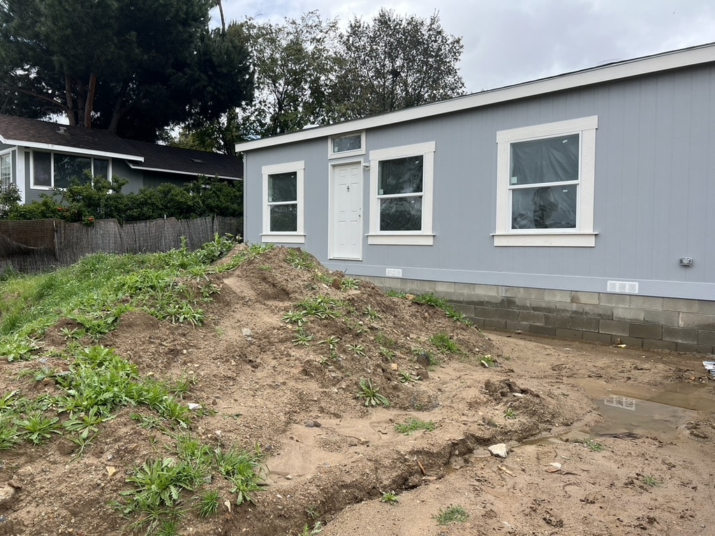 Graded residential site prepared for manufactured home placement
