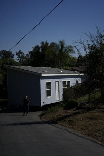 Manufactured home positioned on sloped residential lot