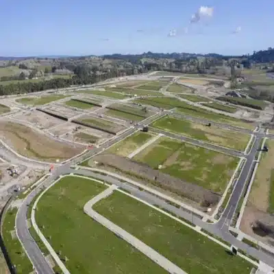 Aerial view of a planned subdivision showing road layout and prepared parcels during land development