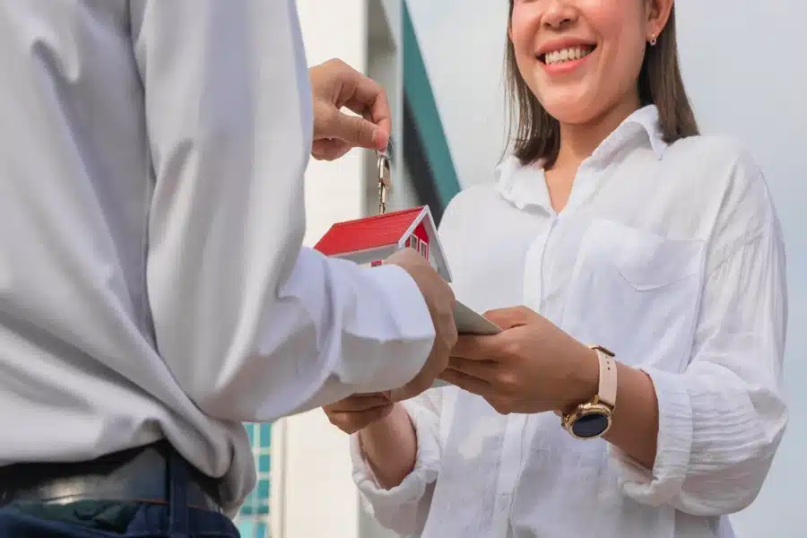 real_estate Home buyer receiving keys during a completed property purchase